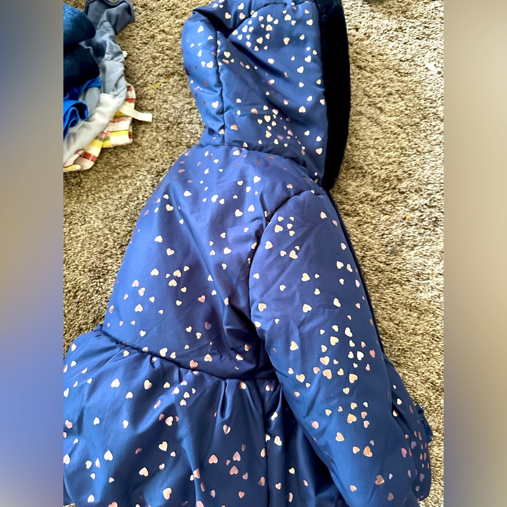 Rothschild 24M winter coat with hood and pockets. Fleece lined, faux fur on hood